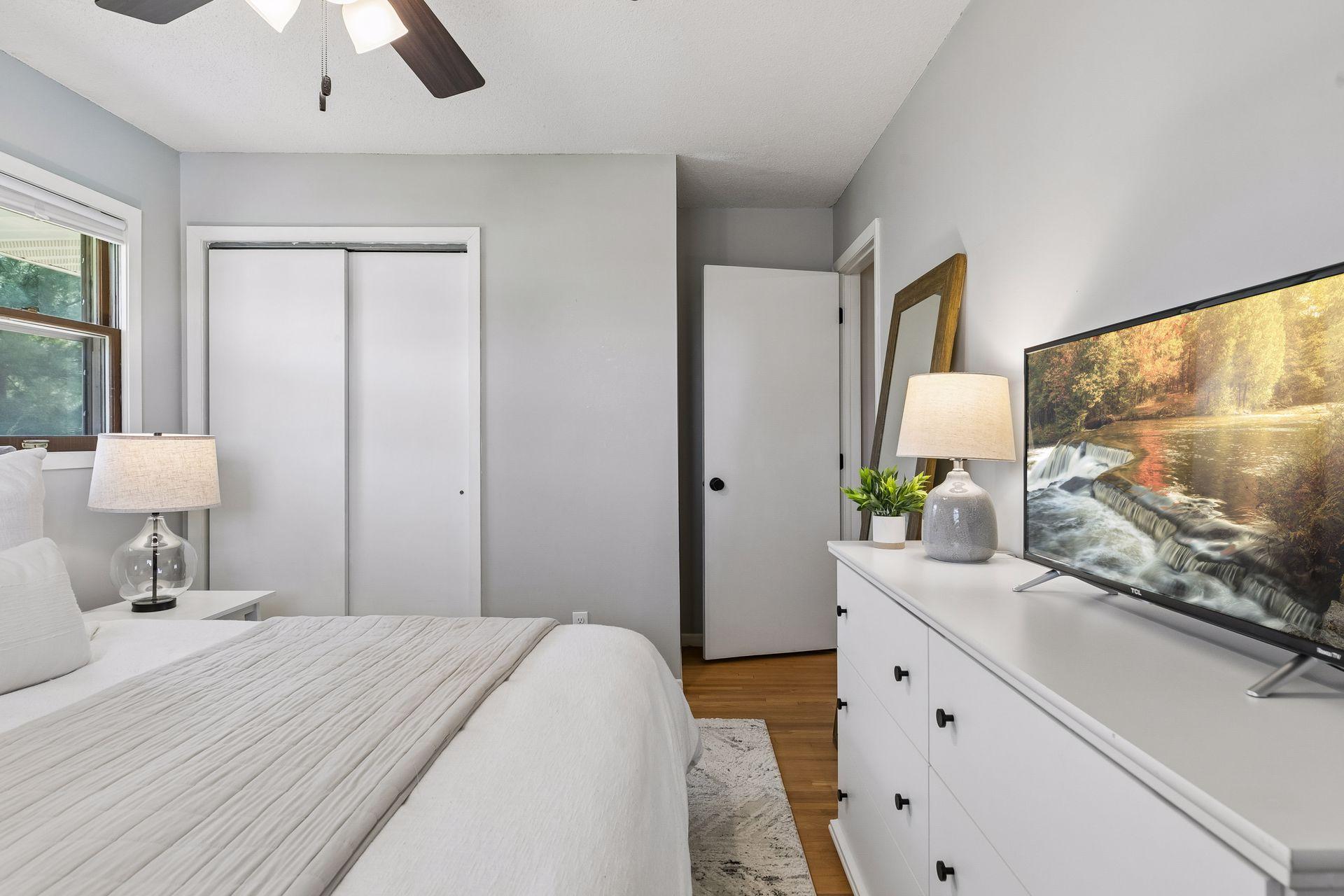 Another view of the primary bedroom showcasing its generous size.