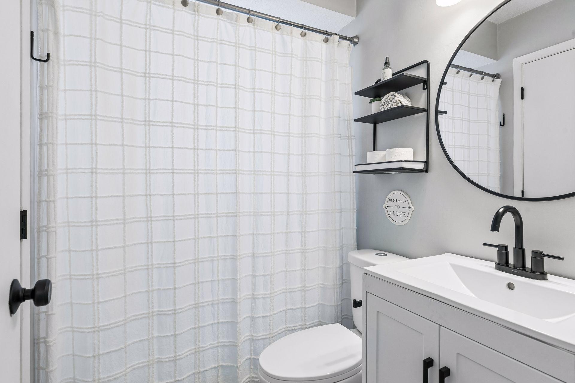 Full bathroom shower with updated features.