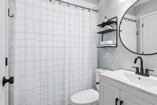 Full bathroom shower with updated features.