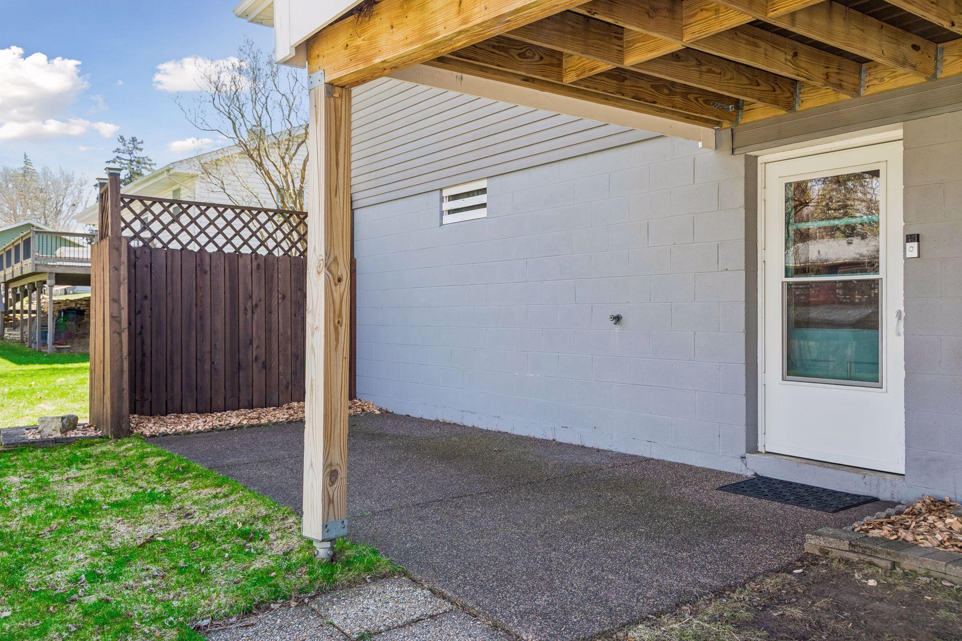 Walkout access to a covered patio area beneath the deck.