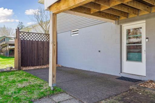 Walkout access to a covered patio area beneath the deck.