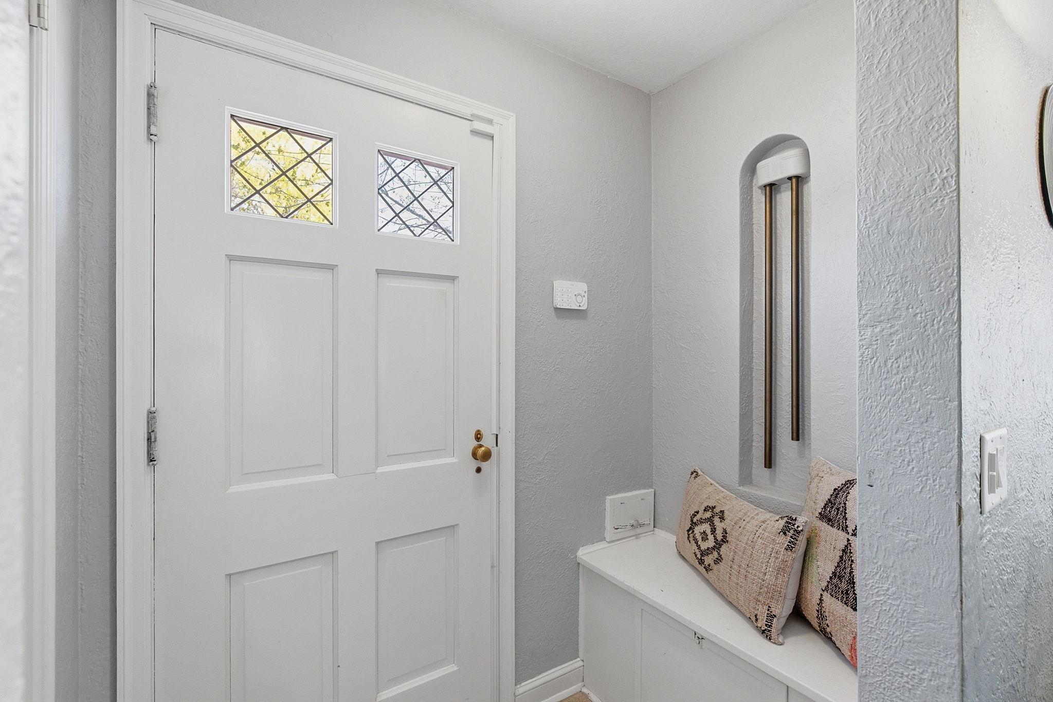 Entrance with closet, bench seat and cute mail slot.
