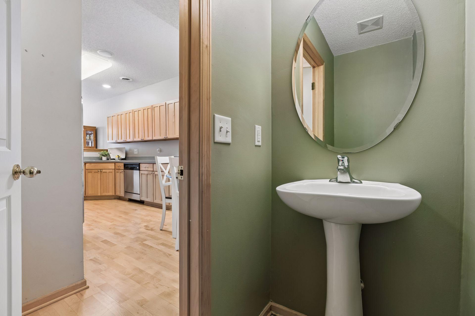 Convenient 1/2 guest bathroom located just off the kitchen.