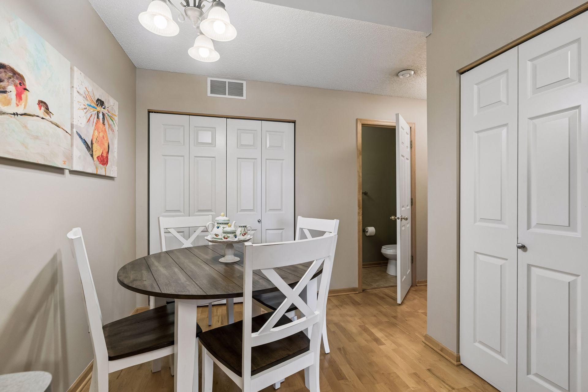 Charming informal dining area with a pantry closet and utility closet nearby.