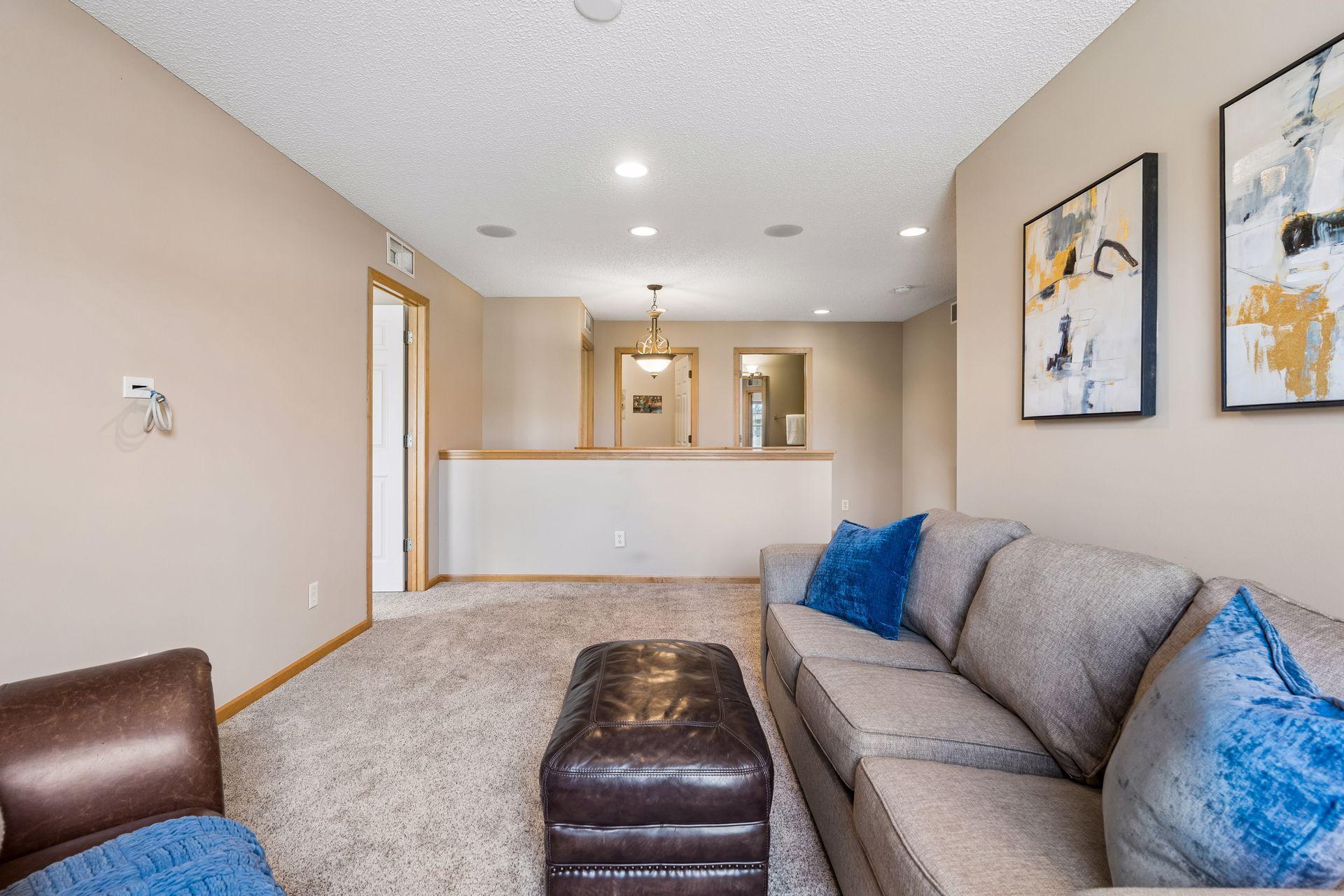 The upper level hosts a loft, three spacious bedrooms, two full baths and a laundry room.