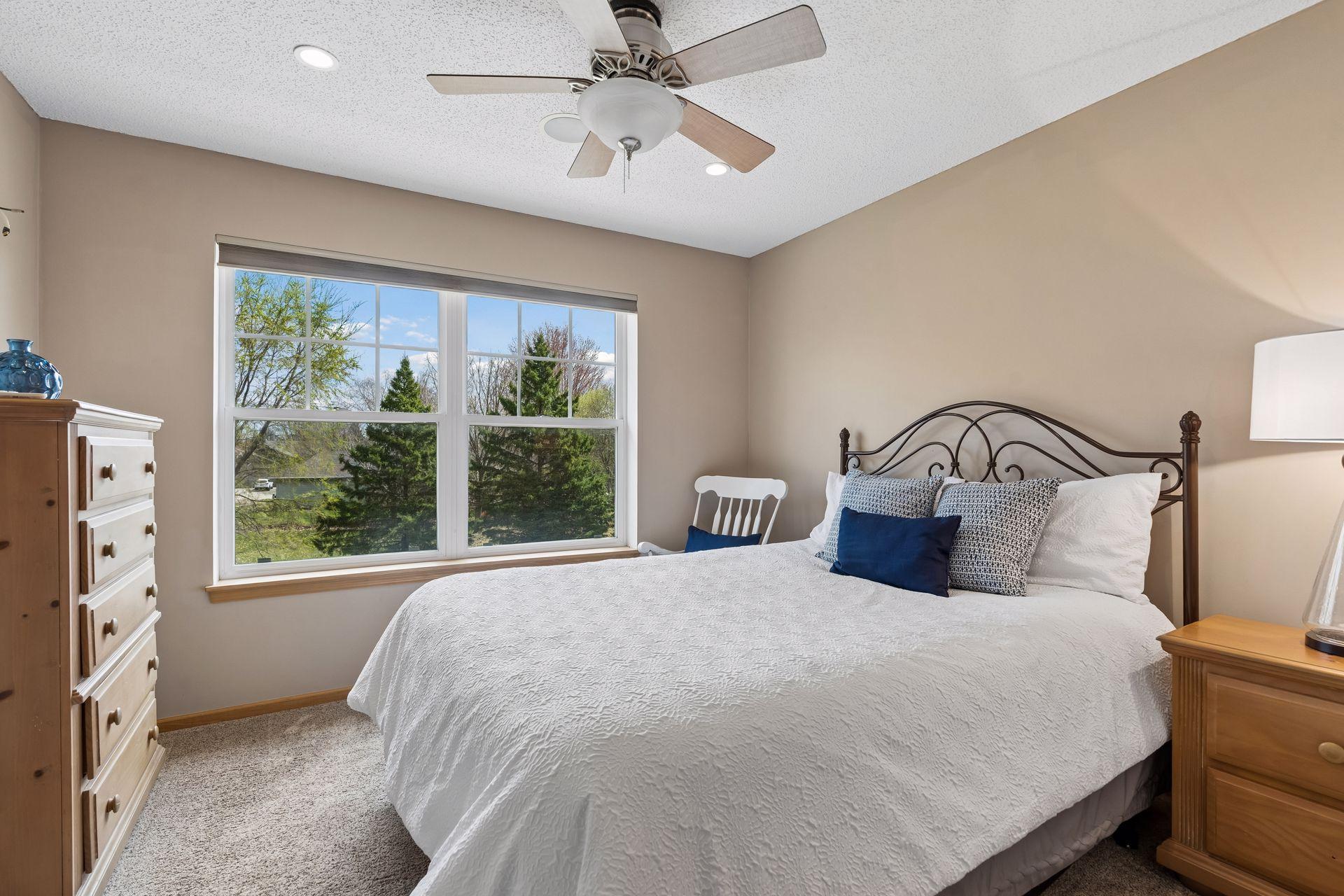 Bedroom #3 has multiple windows and a ceiling fan.