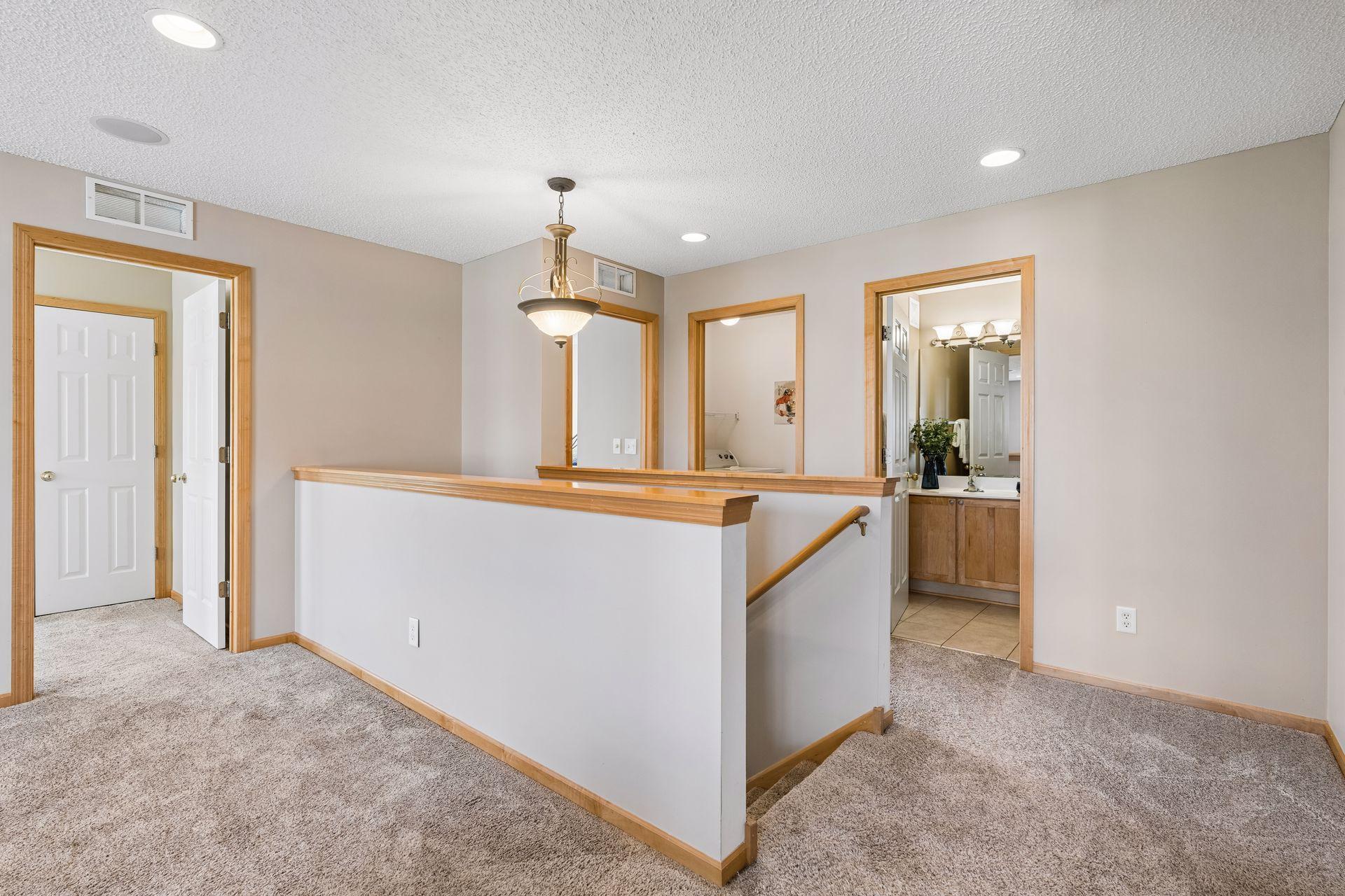 Spacious landing and wide hallways throughout the upper level.