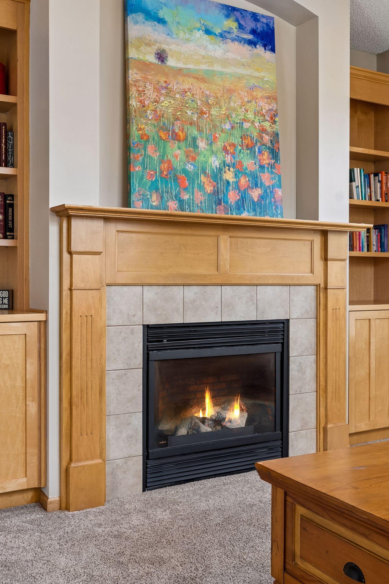 Arched niche above the fireplace, perfect for artwork or a wall mounted television.