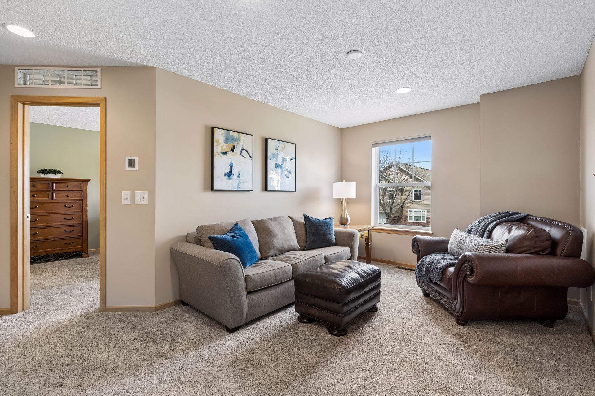 Another view of the upper level loft area, behind the chair is the hub for all the media wiring for this home.