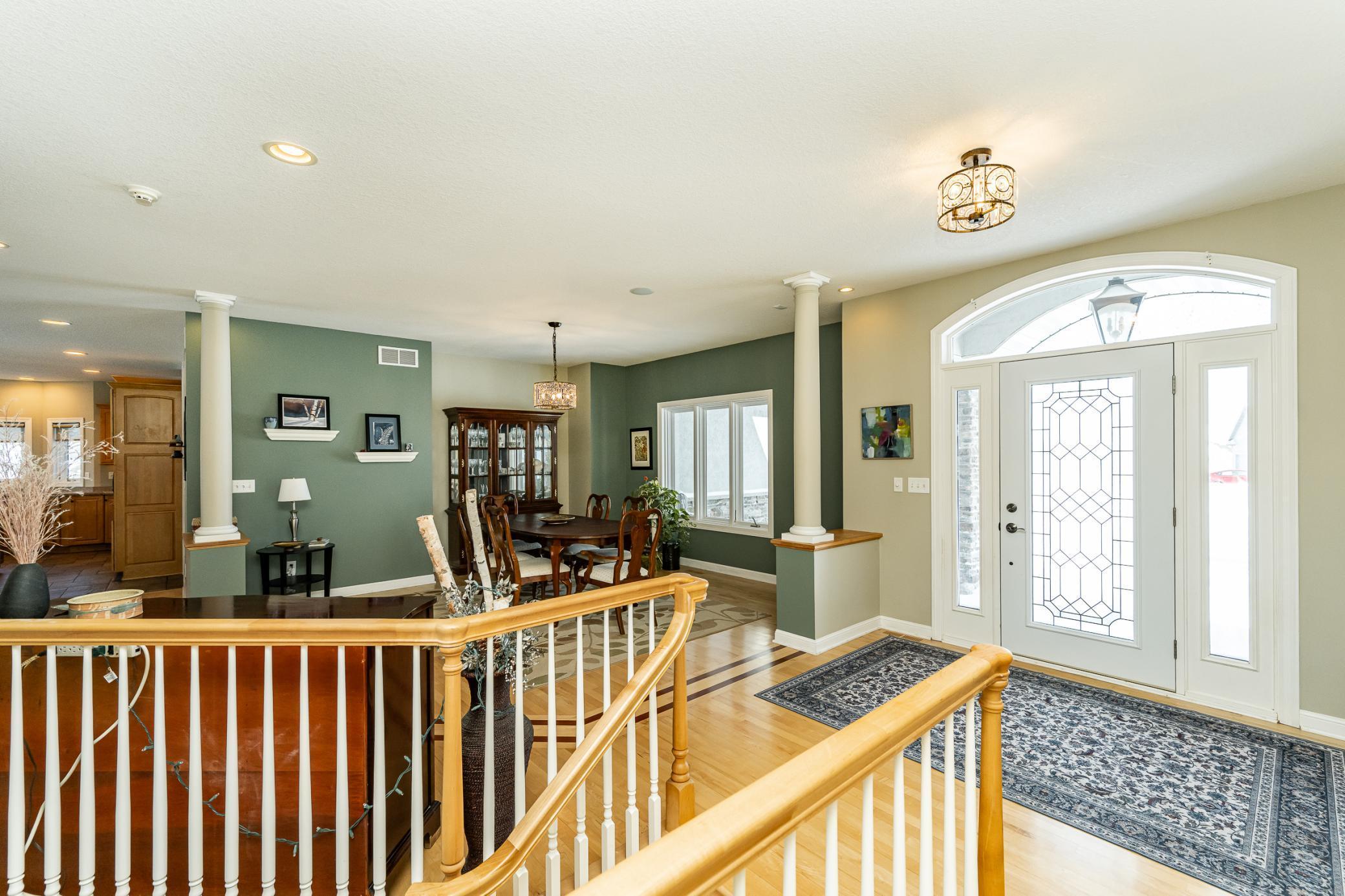 Off side of entry way looking toward front door and formal dining room