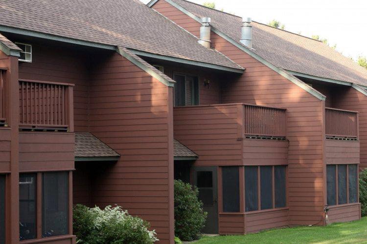 Rear screened in porch and deck sits right ont he golf course