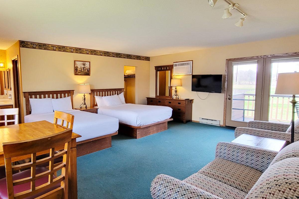 upstairs bedroom with 2 queens and a pullout bed.