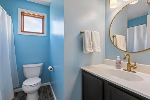 The full-bath has been recently painted a cheerful blue!