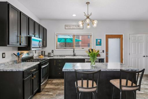 A door off the kitchen leads to a spacious patio for outdoor relaxation!