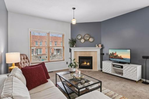 The lovely, gas-burning corner fireplace provides a wonderful accent and focal point!