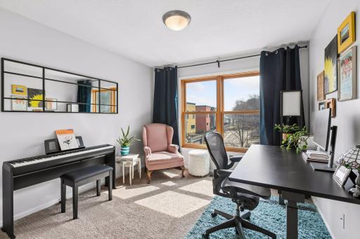 Bedroom two faces east and is currently used as a home office and music room.