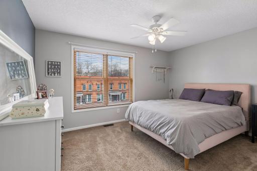 Your spacious, primary bedroom faces west and offers additional space for a chair and dresser.
