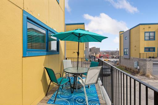 The nicely sized deck/balcony accommodates outdoor seating and container gardens!