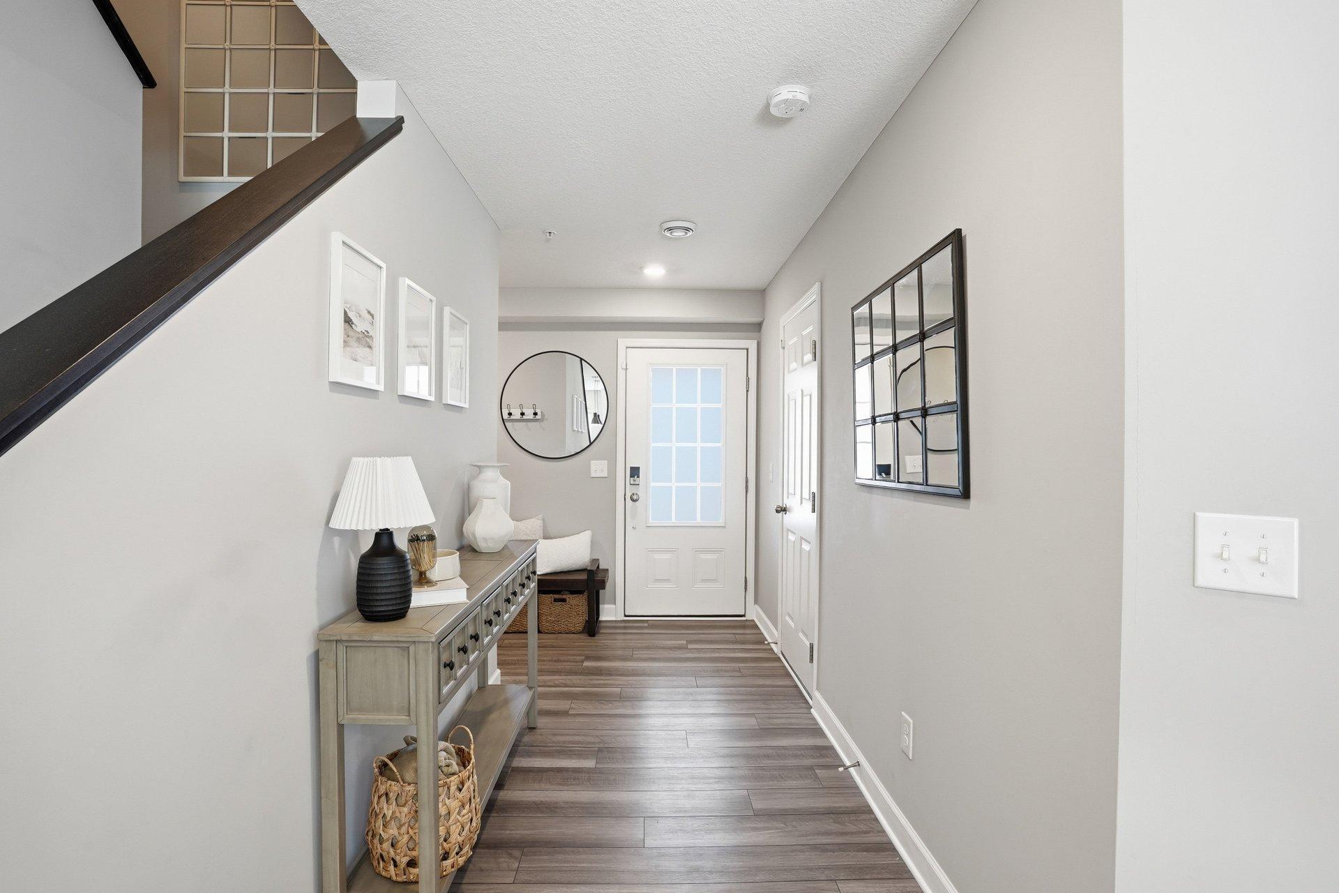 Garage entrance near front door and coat closet.
