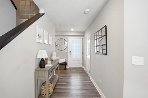 Garage entrance near front door and coat closet.