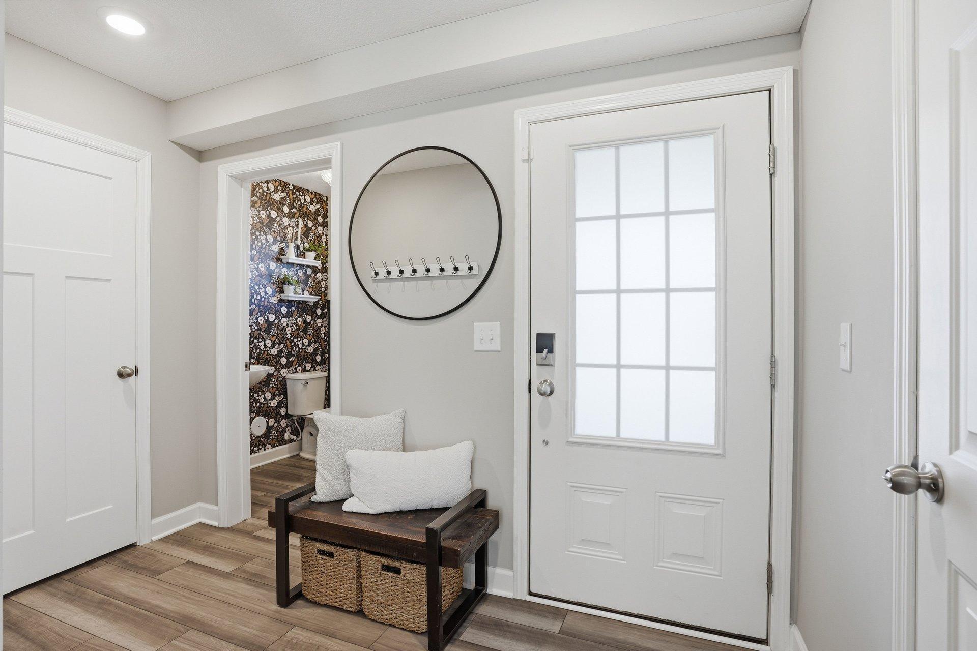 Welcome home! The entryway has a coat closet and convenient powder room.