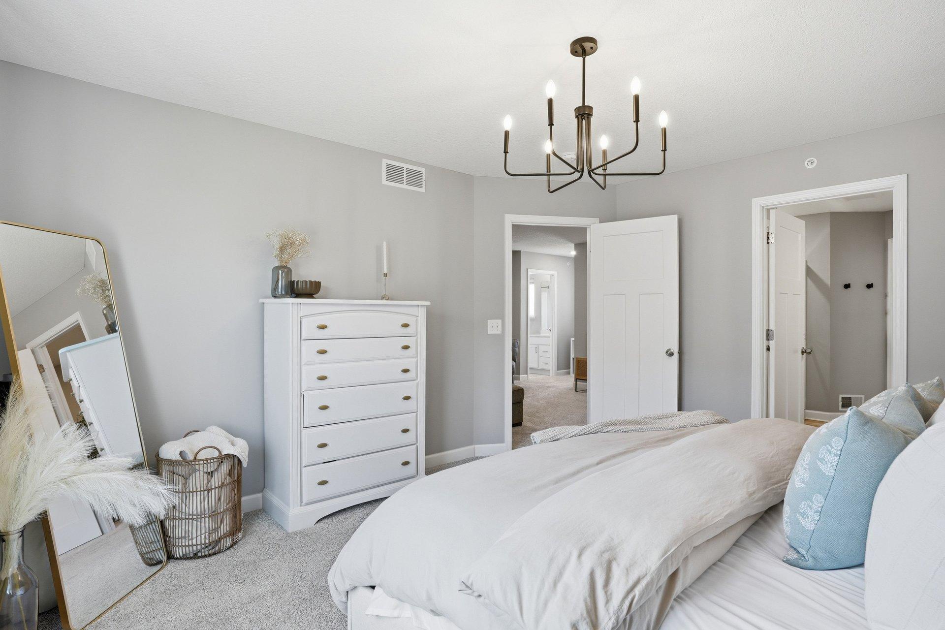 Primary suite has more than enough space with an ensuite bath and walk-in closet.