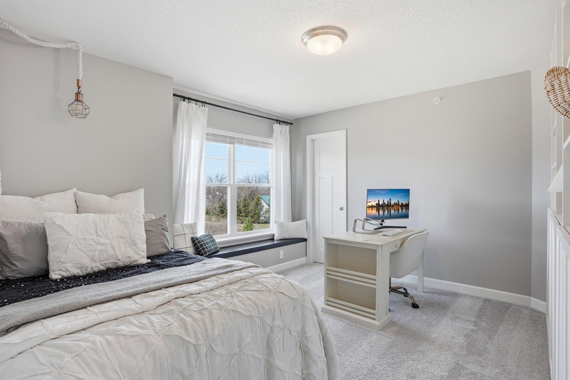 2nd bedroom offers a walk-in closet and window bench seat.