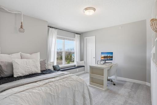 2nd bedroom offers a walk-in closet and window bench seat.