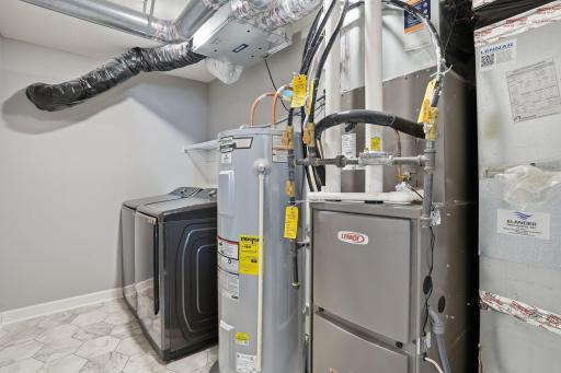 Upper level laundry/utility room. Seller purchased water softener, RO system, washer/dryer in 2023.