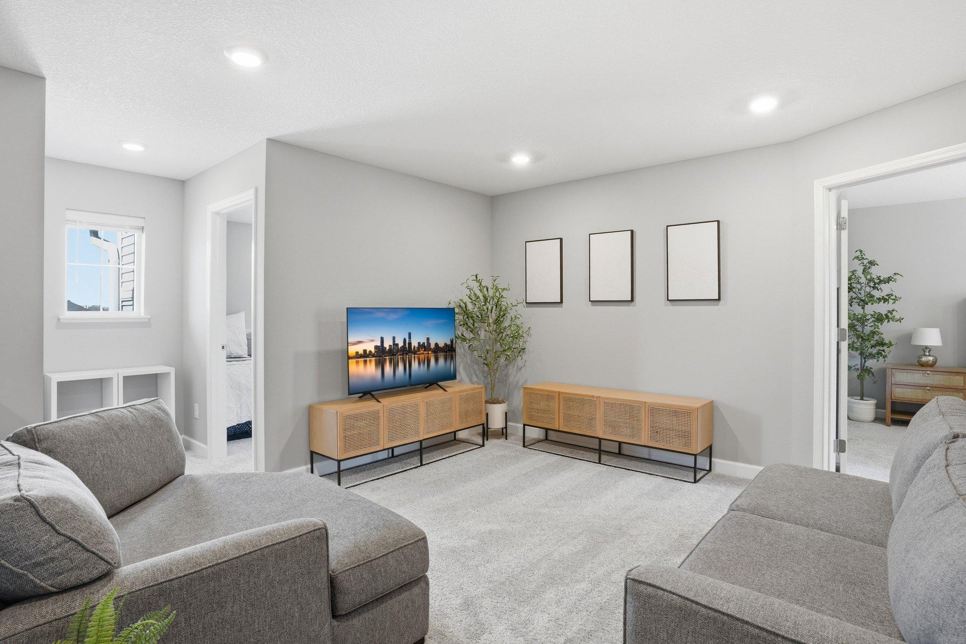 Upper-level loft is truly a flex space and would make a great media room, office, playroom or exercise space.