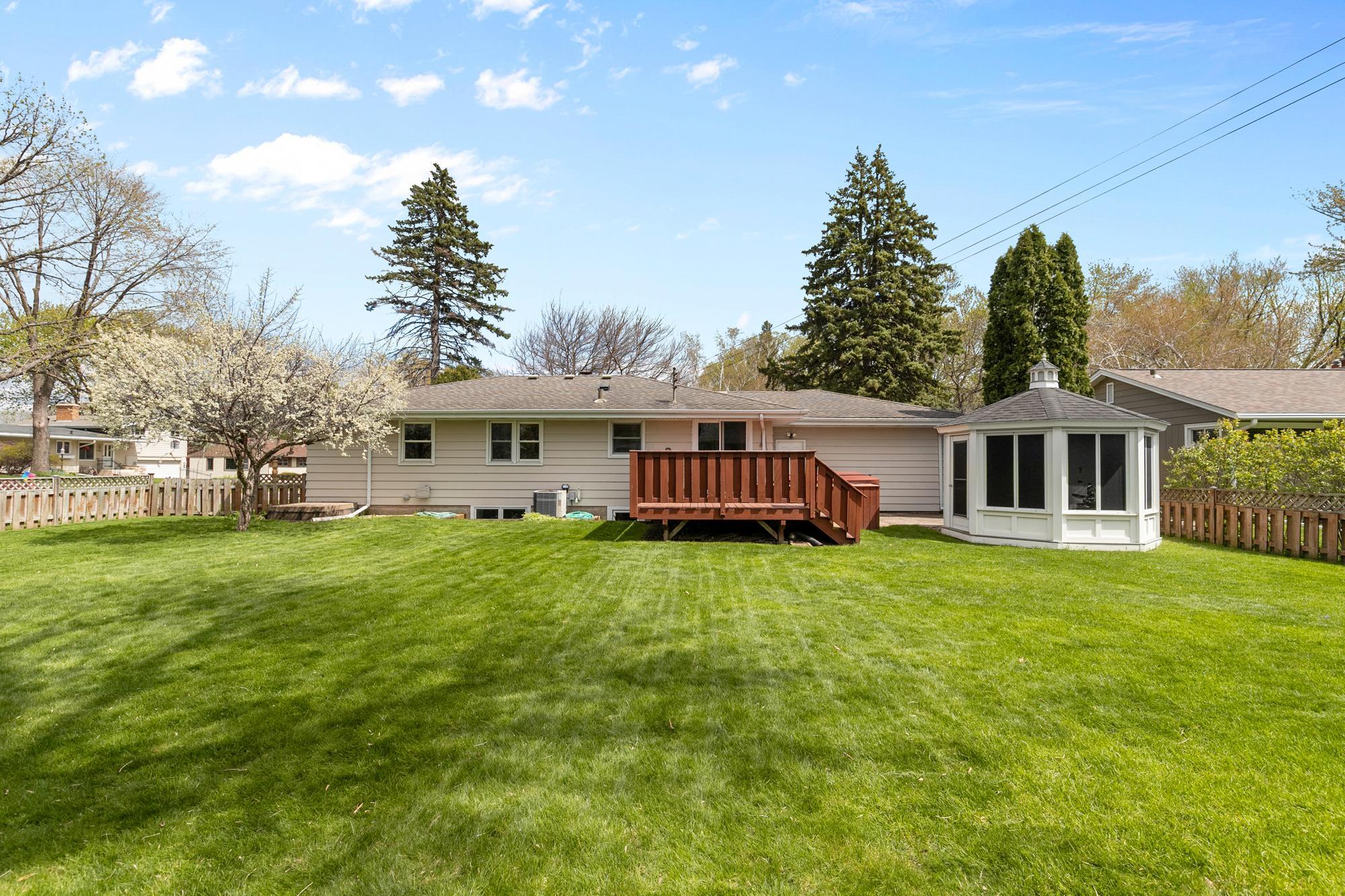 The plumb tree to the left of the home is in full bloom and looks and smells amazing. This large flat yard makes entertaining options endless - games, weddings, graduation parties - think of all you could do!