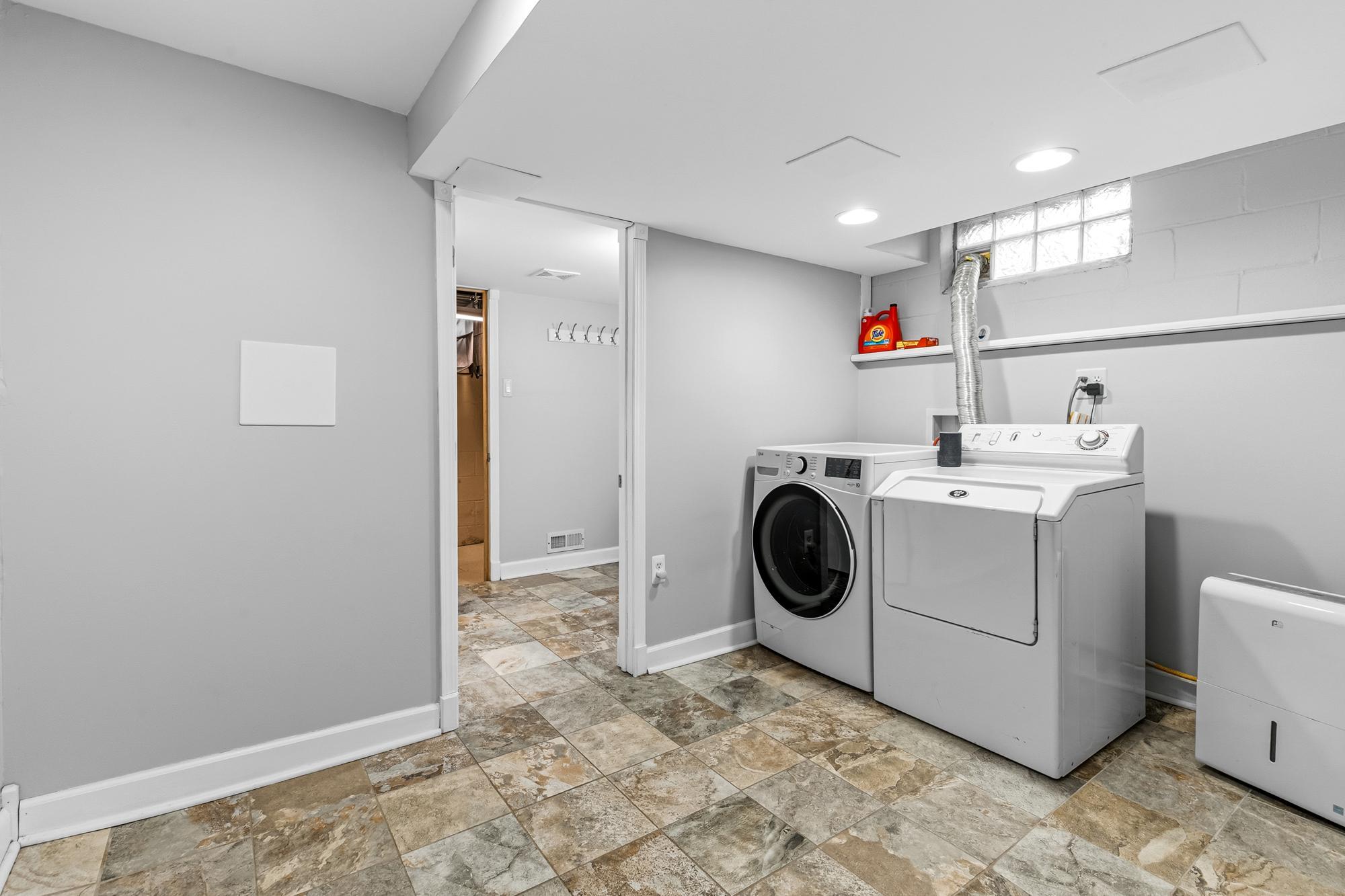 Laundry room that leads to the lower level 3/4 bath.