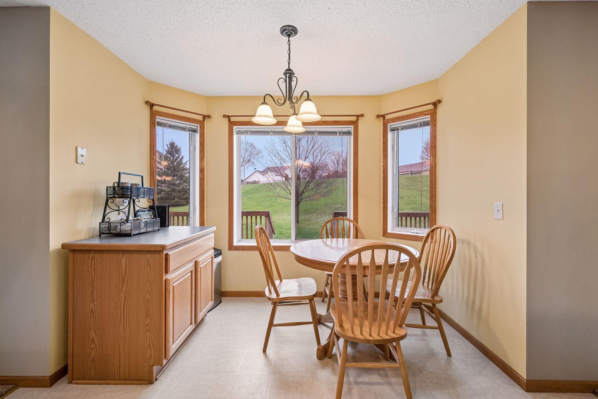Eat-in kitchen space with cabinetry that can be used as a coffee bar, buffet space, or removed to add a larger table.