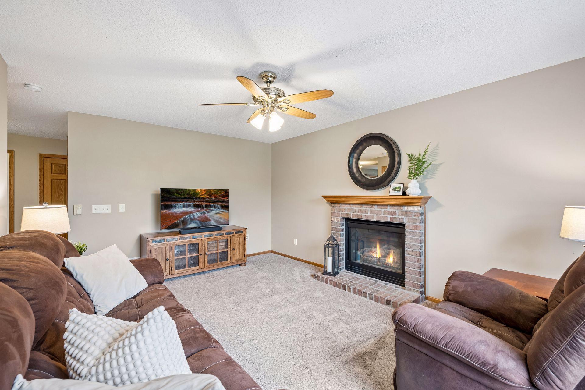 Family room with gas fireplace. Room size allows for flexibility of furniture placement