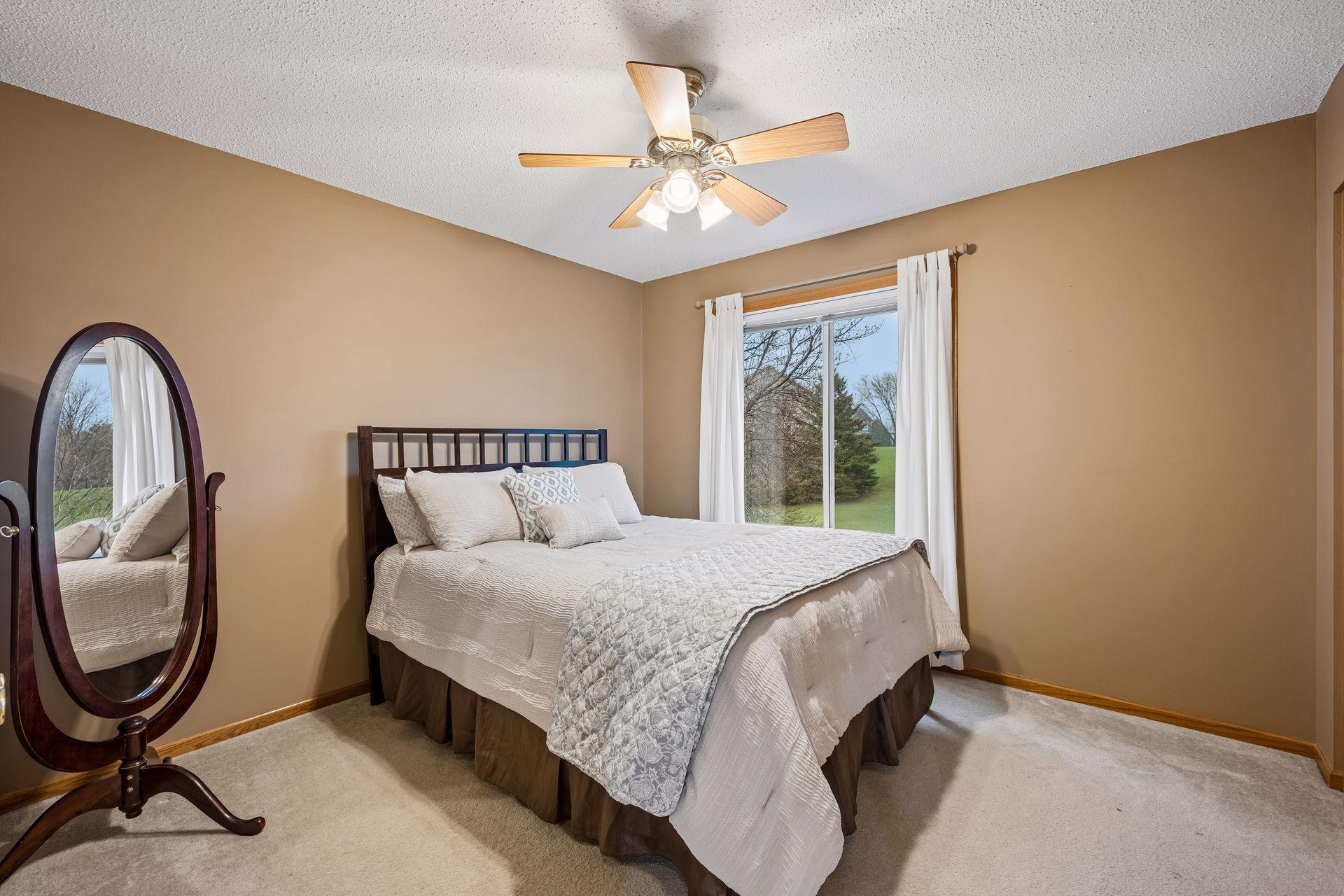 Bedroom #2 with windows facing backyard