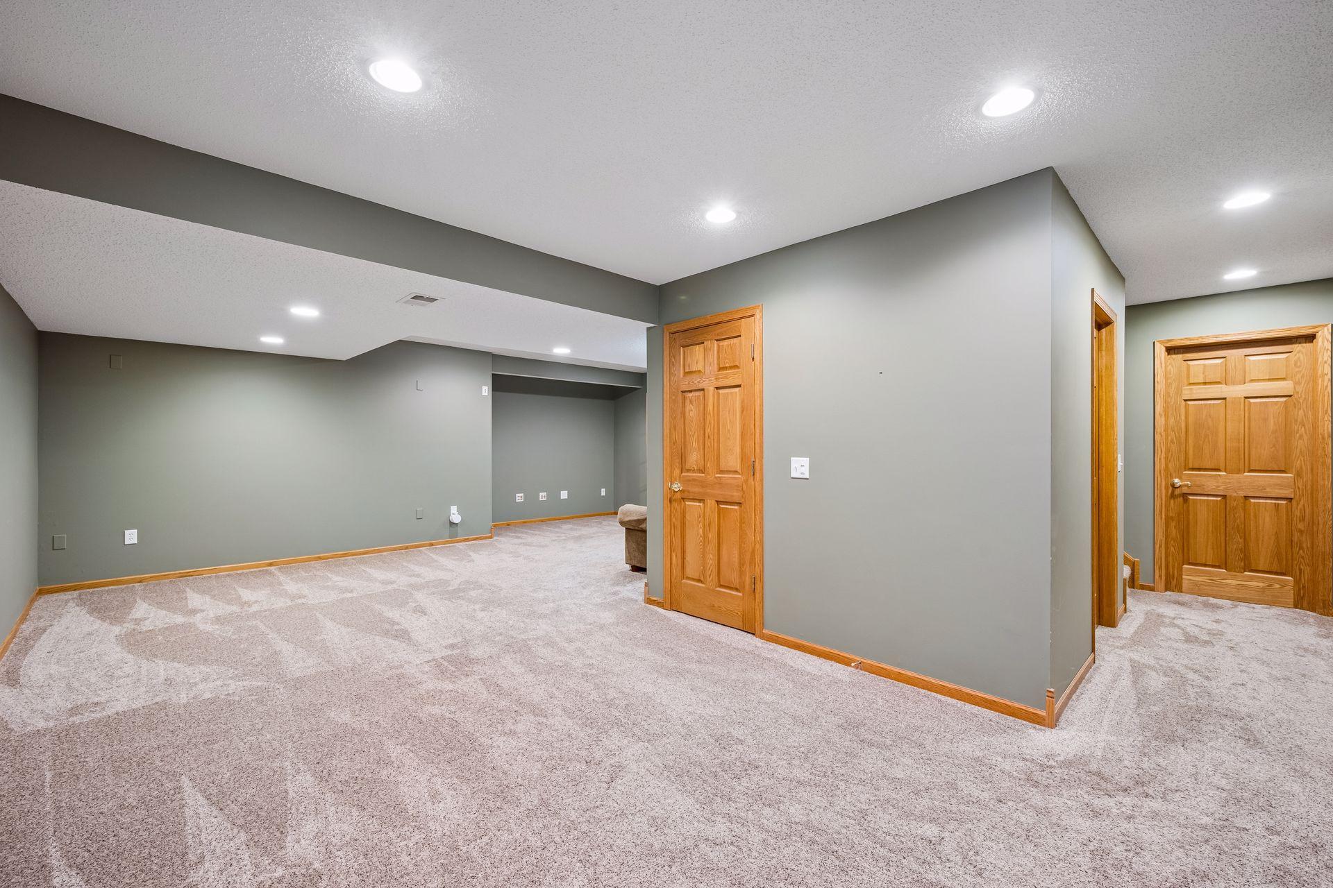 Expansive lower level amusement area - L shaped. Flexibility to use the space how you want to - media room, games, playroom, crafting, etc.