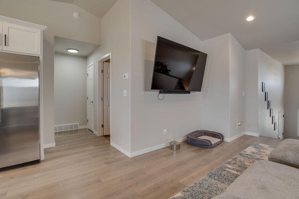 Hall to Half Bath and Primary Bedroom