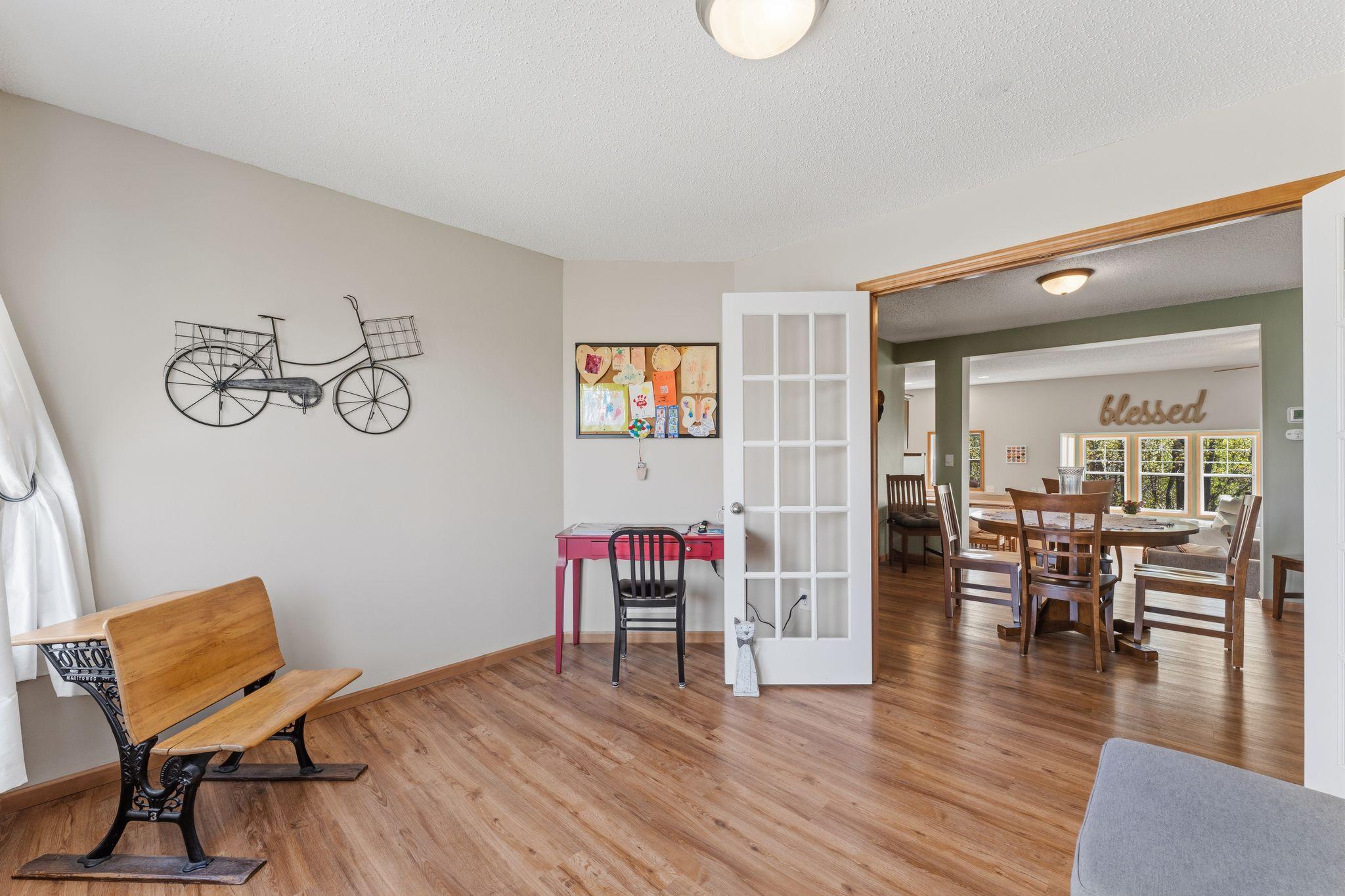Flexible front room ideal for a home office, playroom, or additional living space with French door entry.