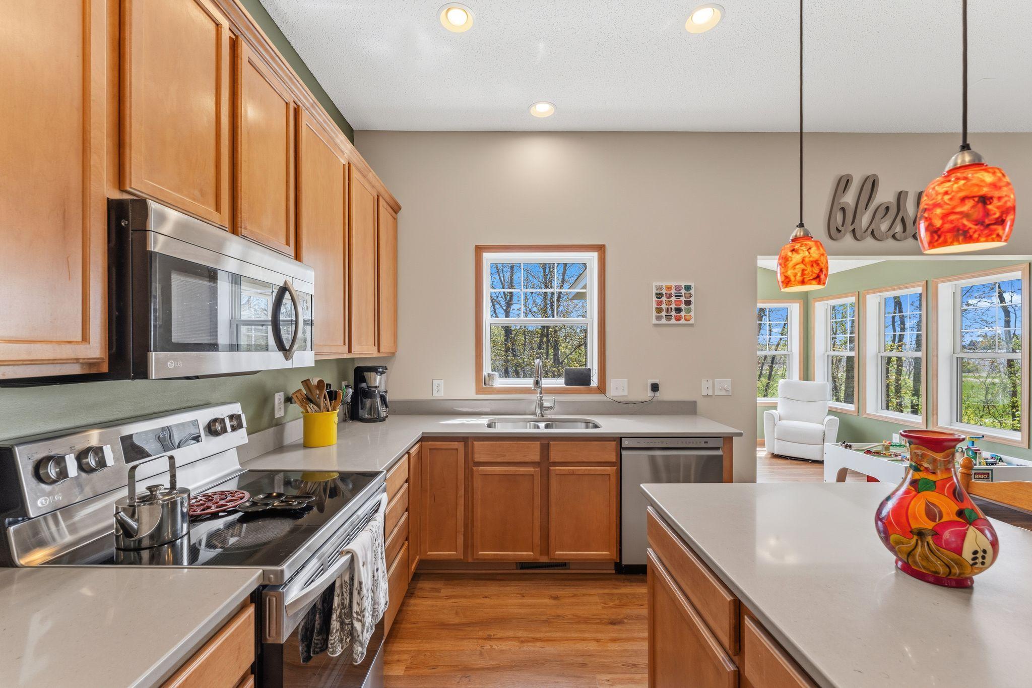 Alternate view of the kitchen highlighting functional layout and generous Quart Counter space
