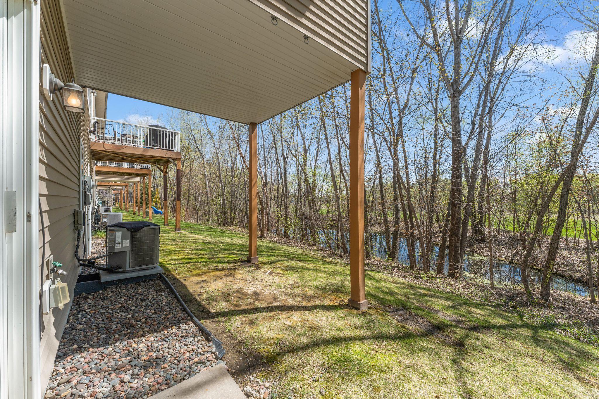 Private backyard setting with wooded views.