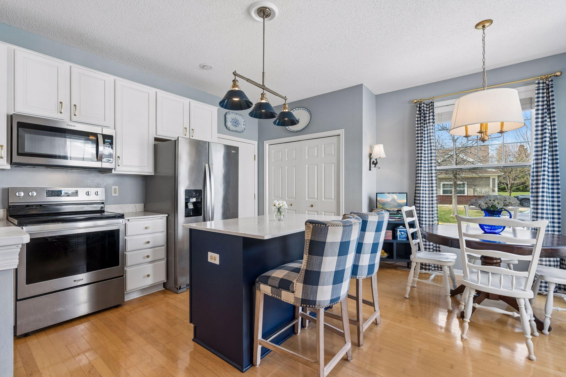 Functional and inviting kitchen with extensive counter space and a sizable island perfect for gathering.