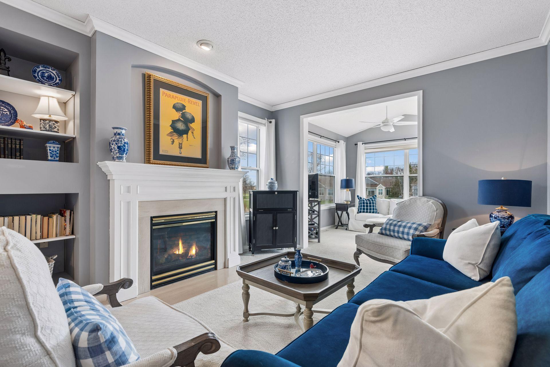 Gather around the gas fireplace in this spacious living room with functional built-ins.