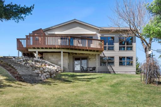 Professionally Landscaped Rock Wall with Stairs Leading to the Main Level