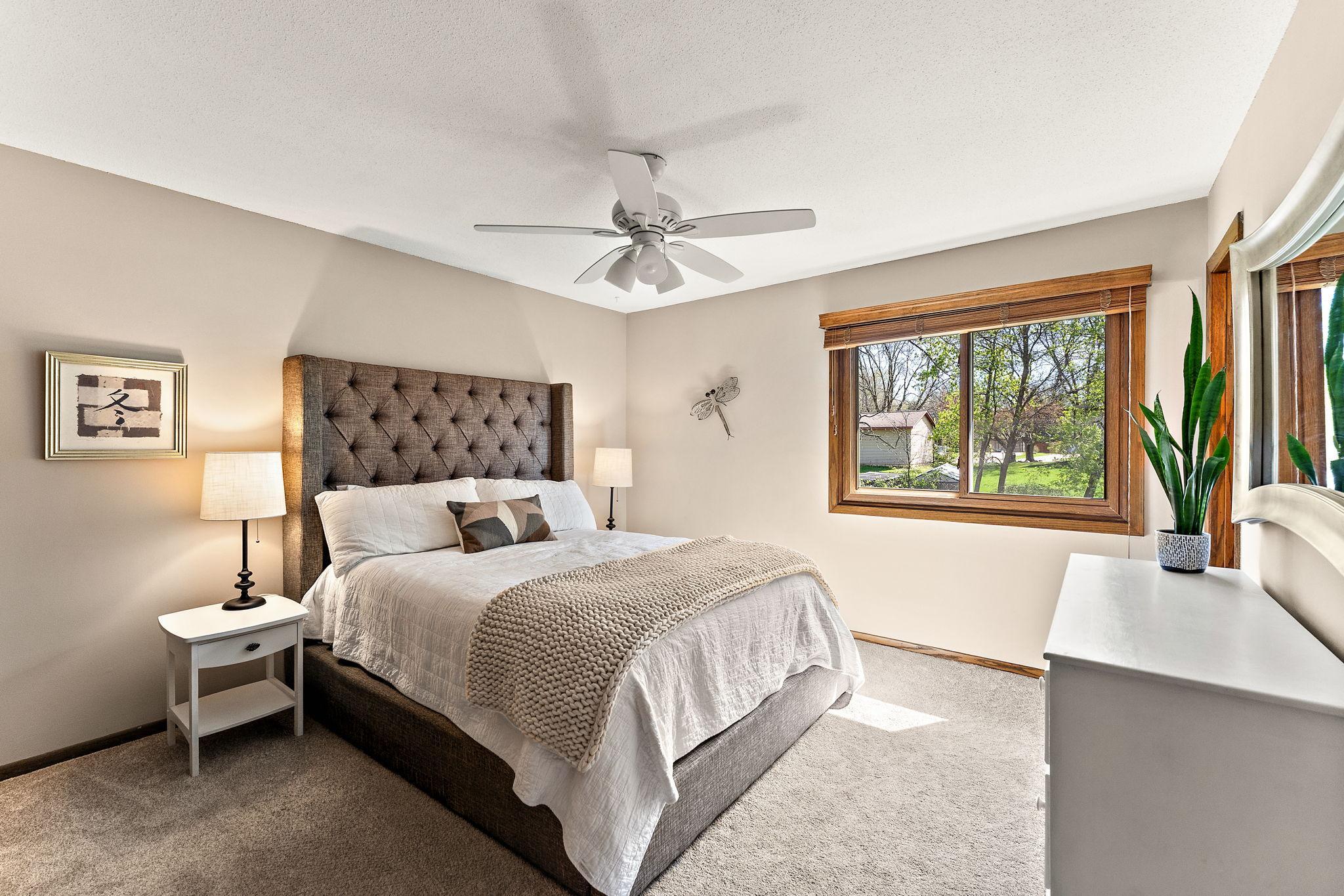 Primary bedroom overlooking the backyard