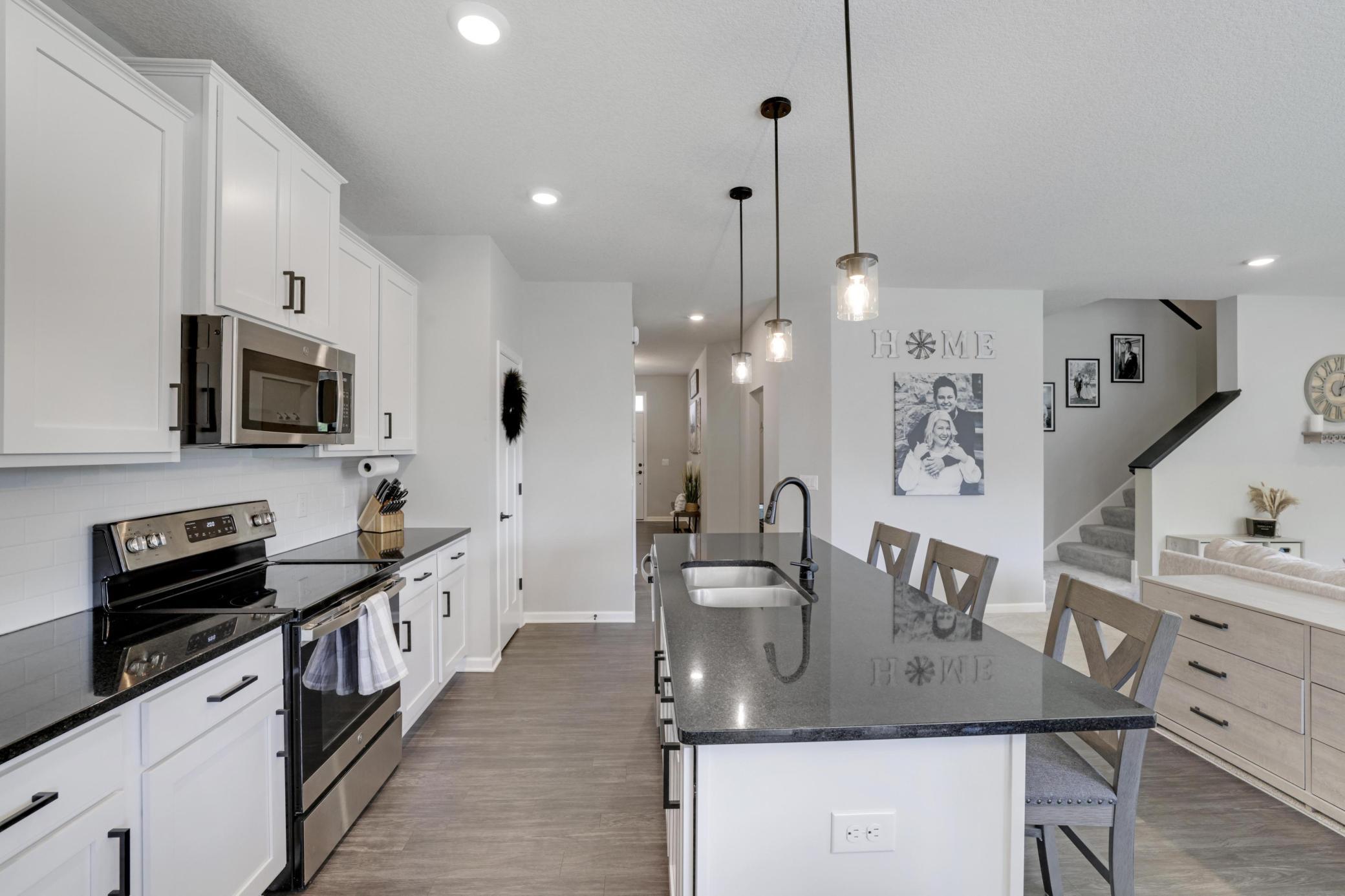 Kitchen and view of the stairs going upstairs!