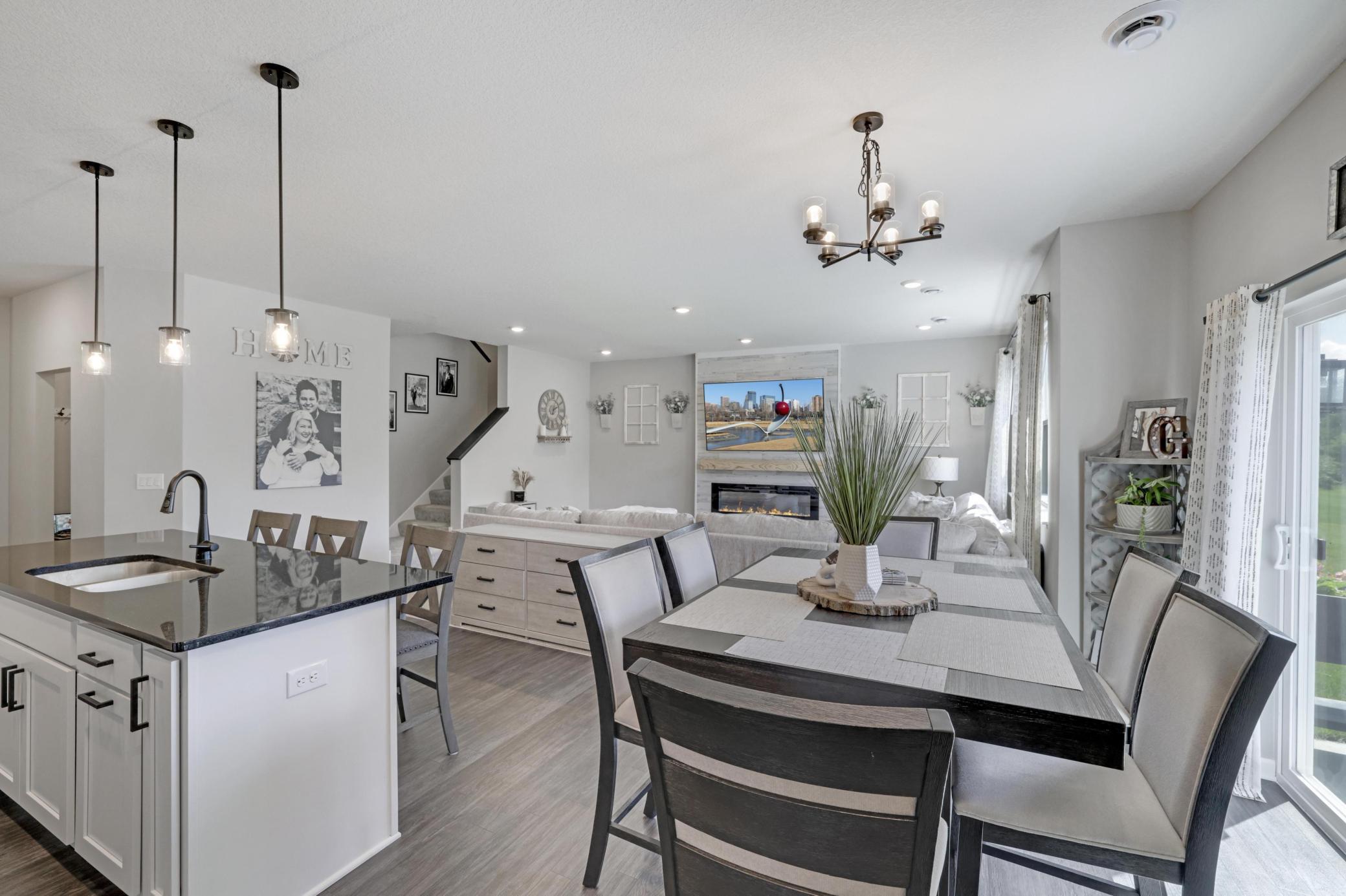 Another view of dining room, kitchen, great room and staircase!