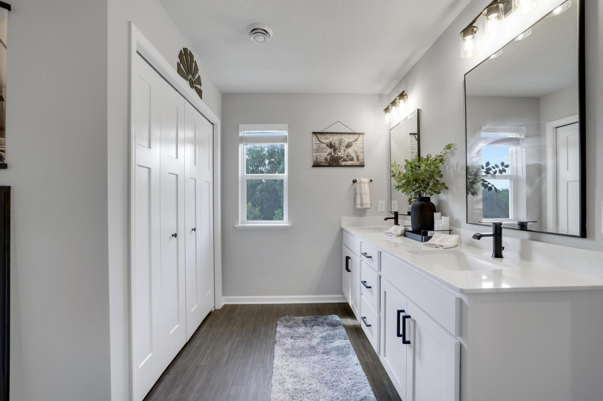 Primary ensuite with ample storage and 2 sinks!