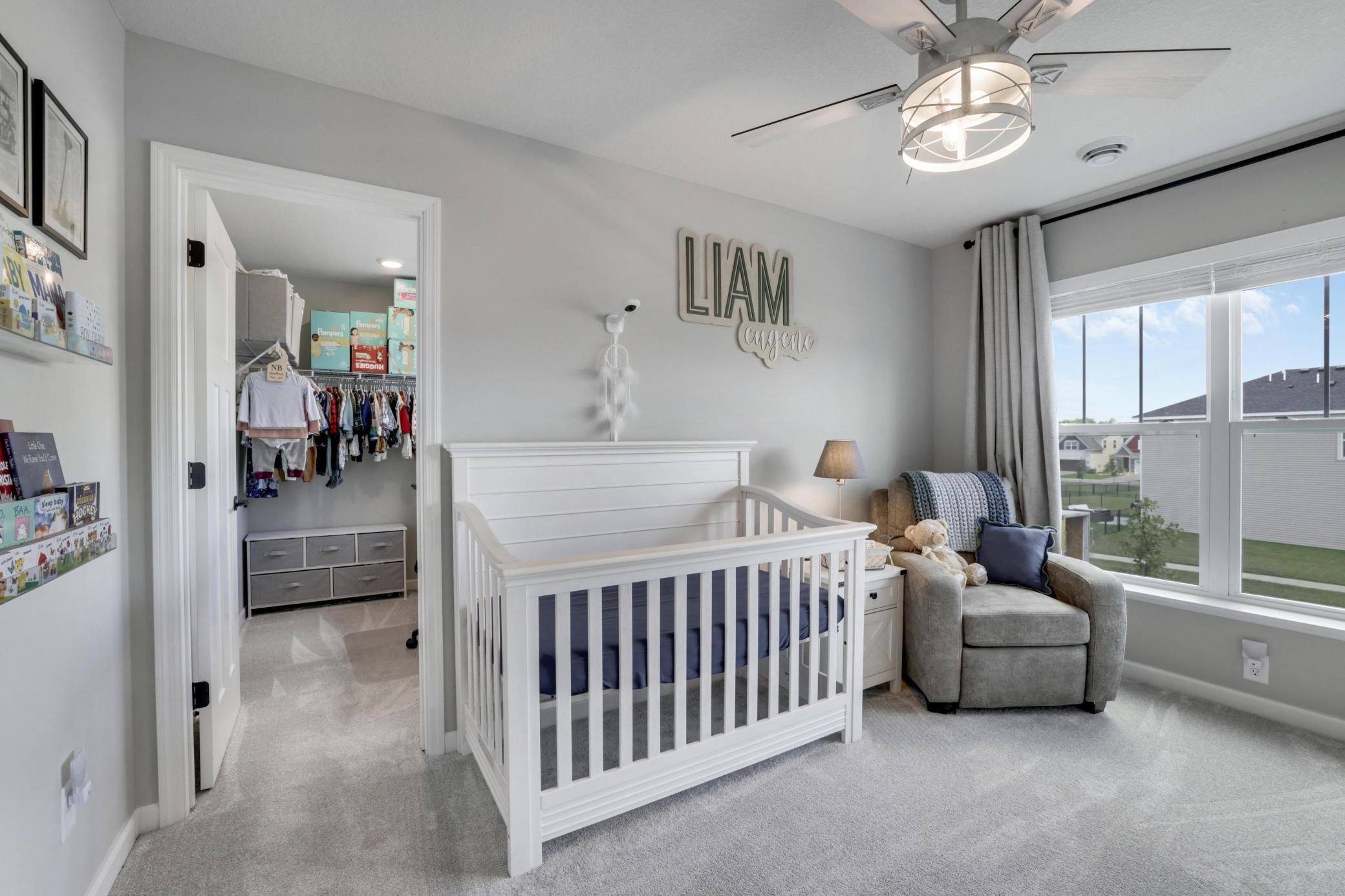 Another view of bedroom with attached walk in closet.