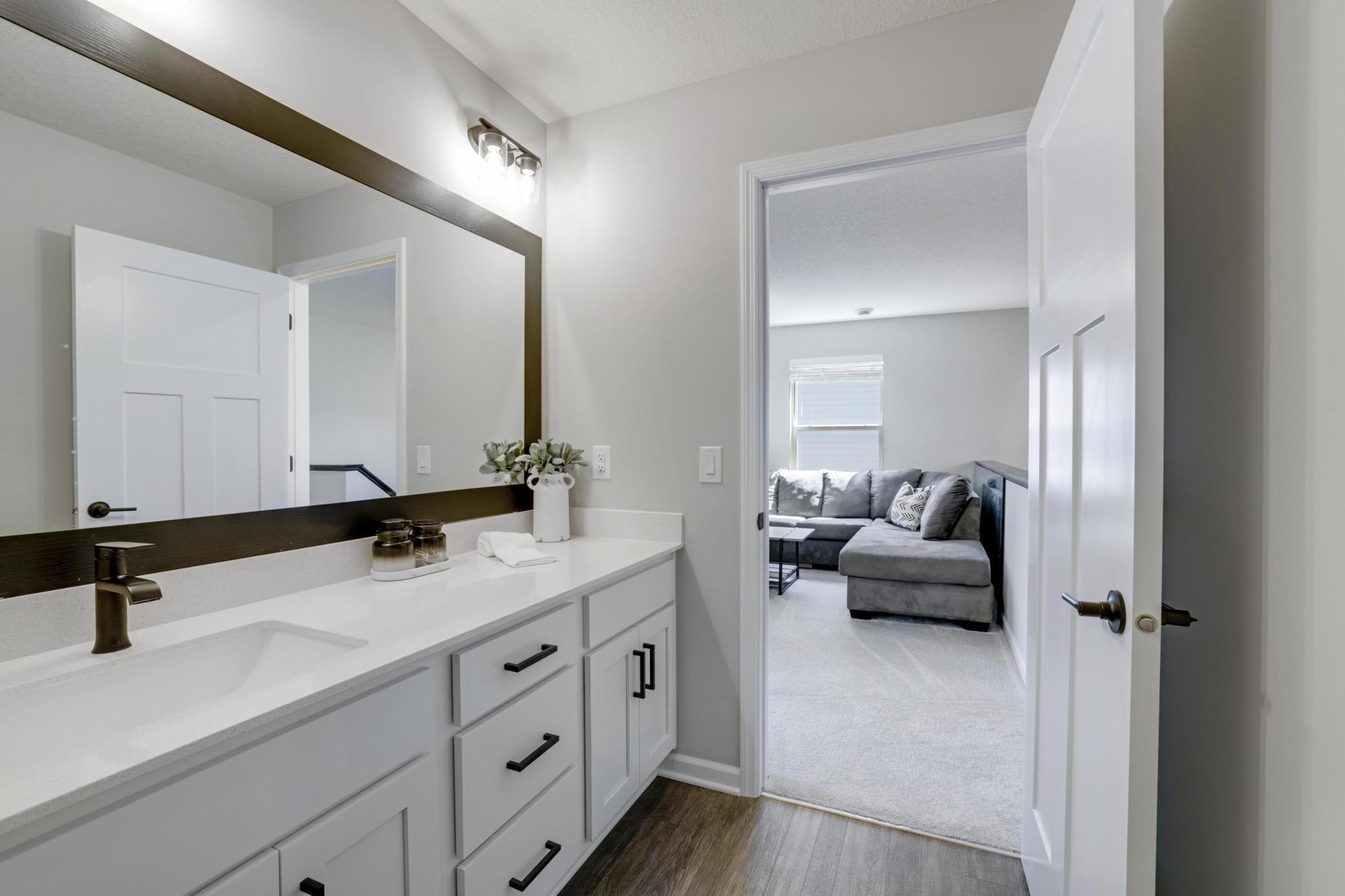 Another view of the upper level bath looking into the loft/office.