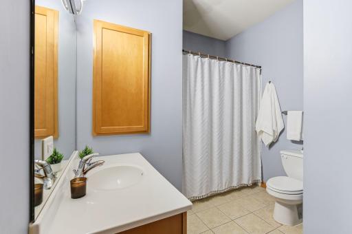 Upper-level full bath offering a clean, functional design with a full tub and shower combination